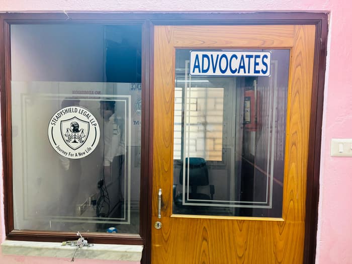 The chambers entrance, with the Steadyshield Legal LLP seal etched on the door glass.